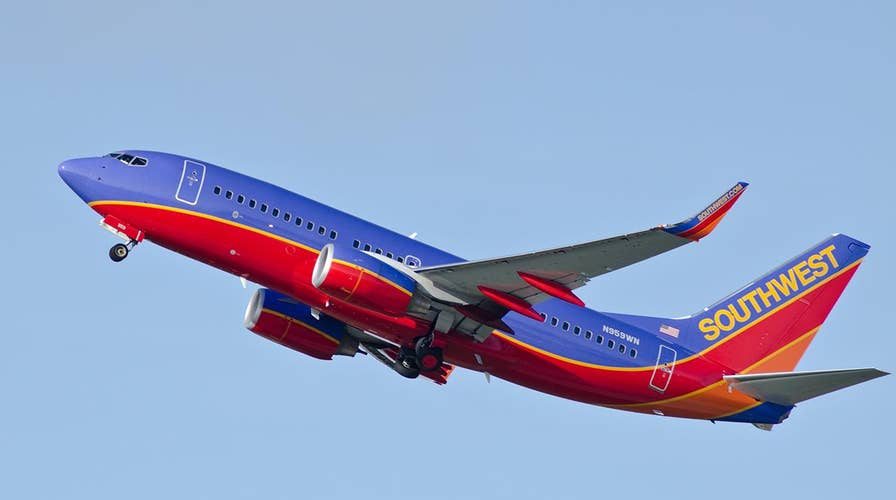 Flight attendant does strip-tease like safety demonstration