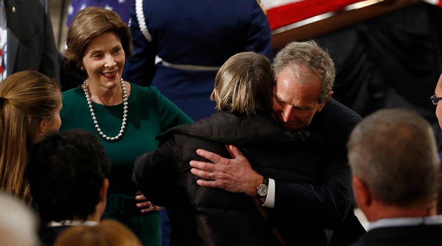 Bush family arrives at Capitol rotunda, greet mourners