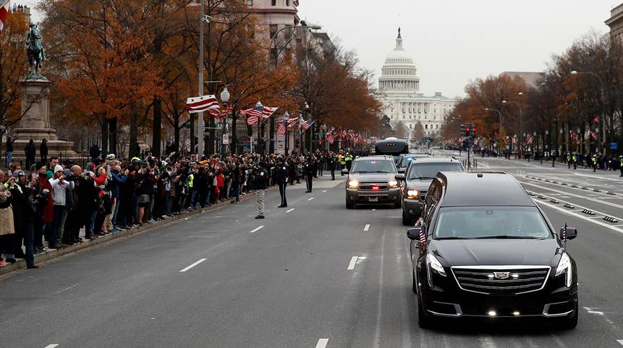 Mourners line streets to watch Bush 41 motorcade in DC