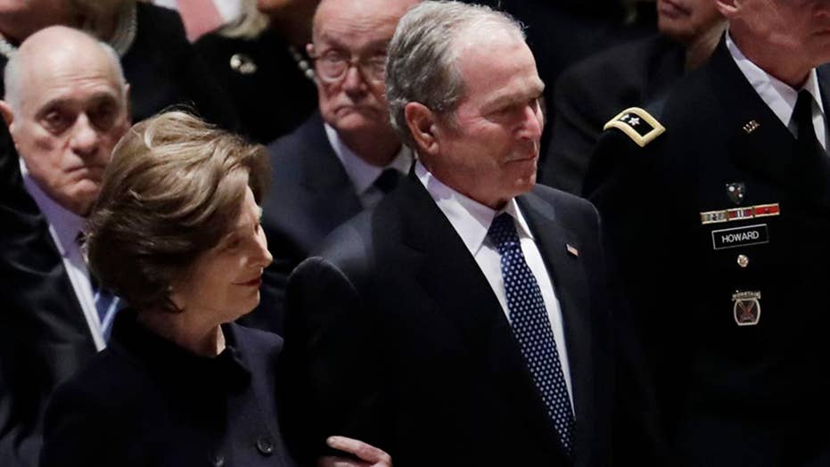 George W Bush Appears To Hand Michelle Obama Something At Father S   694940094001 5975924463001 5975927402001 Vs 