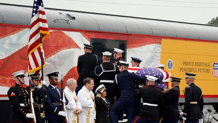 George H.W. Bush casket carried onto funeral train