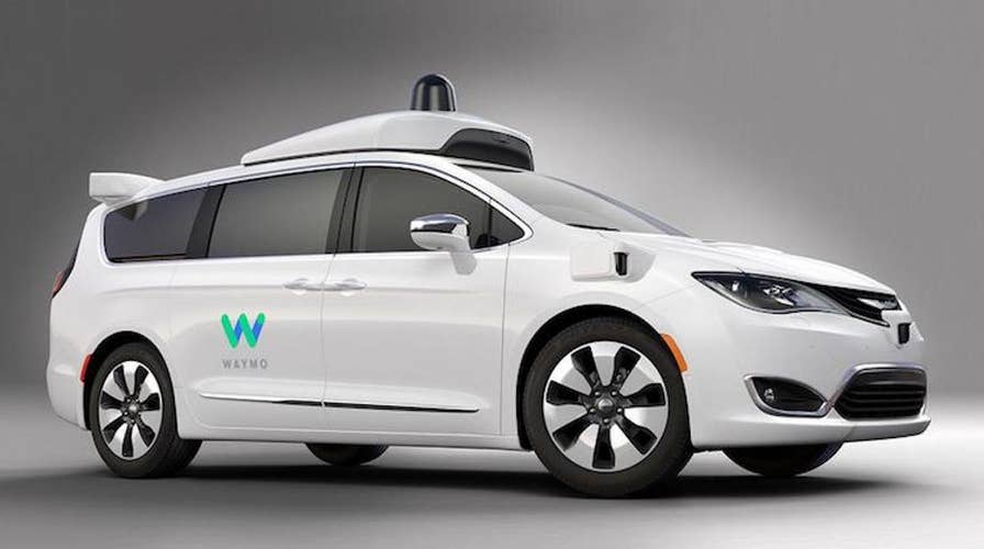 Alphabet launches self-driving taxi service Waymo