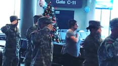 Nashville airport travelers stop to sing national anthem for children of fallen service members, viral video shows