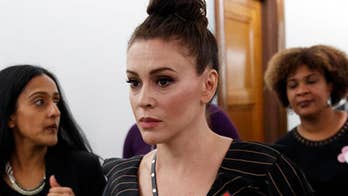 Alyssa Milano: 'The red MAGA hat is the new white hood'