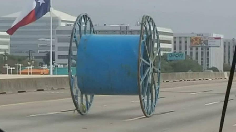 Giant industrial spool rolls down Houston highway