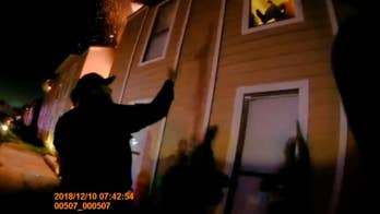 Body cam video shows police officers catching boy who jumped from burning apartment