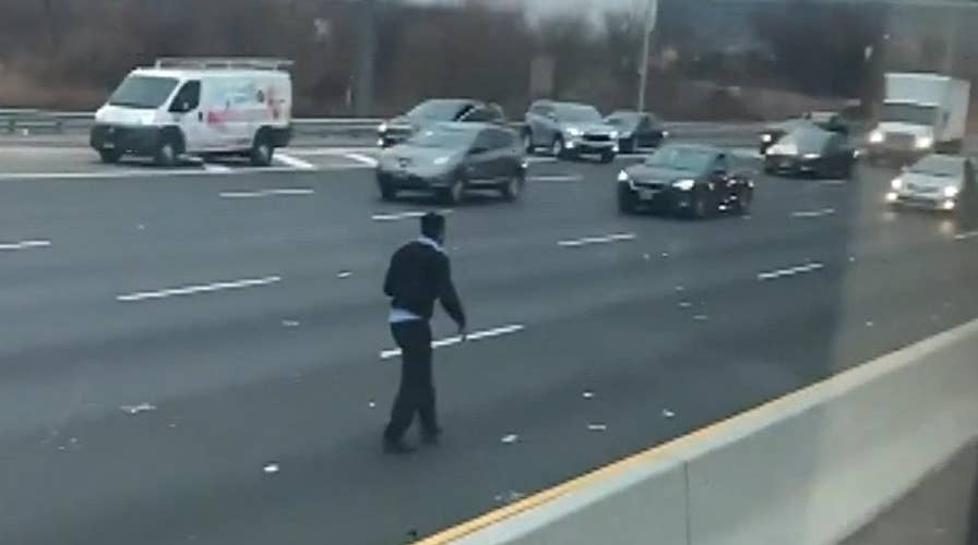 Chaos on New Jersey highway after armored truck spills cash