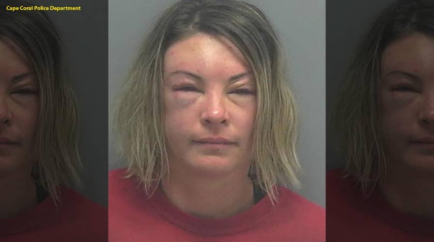 Body camera footage: Florida woman tosses piece of concrete at police officer