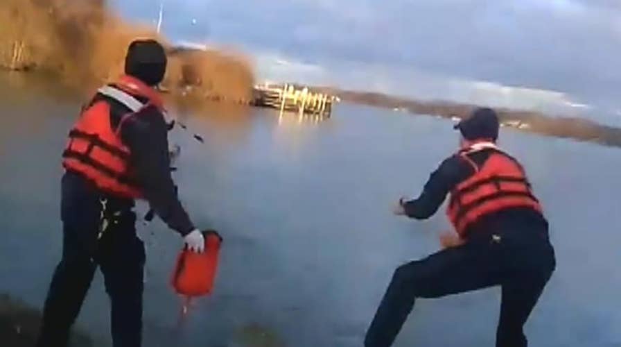 Officer saves woman from sinking car in Detroit River