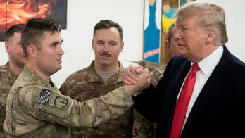 In Iraq, Trump meets soldier who rejoined Army for him
