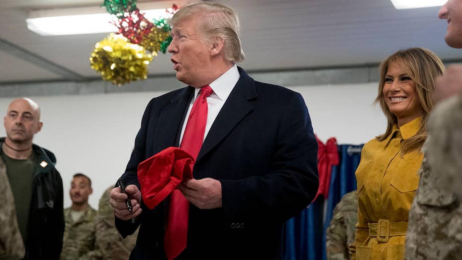 Double standard? Media bash Trump for signing MAGA hats, ignored then-candidate Obama signing autographs for troops