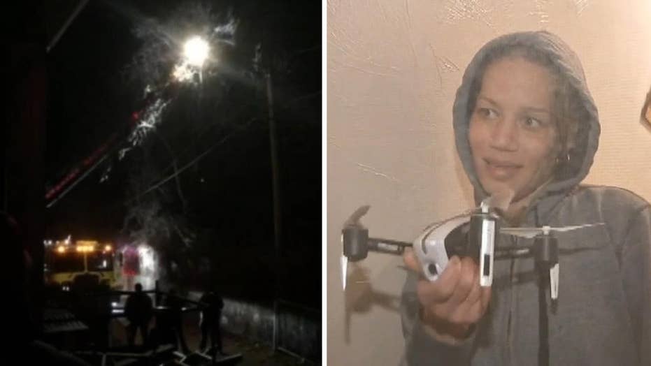Massachusetts woman gets stuck 30 feet up in tree after chasing drone