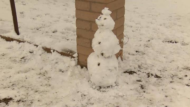 Residents of Vail, Arizona enjoy a rare snowstorm