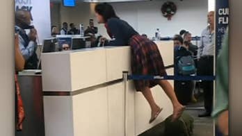 Woman at Fort Lauderdale Airport recorded screaming at JetBlue employee, calling him a 'rapist' and claiming to have gun