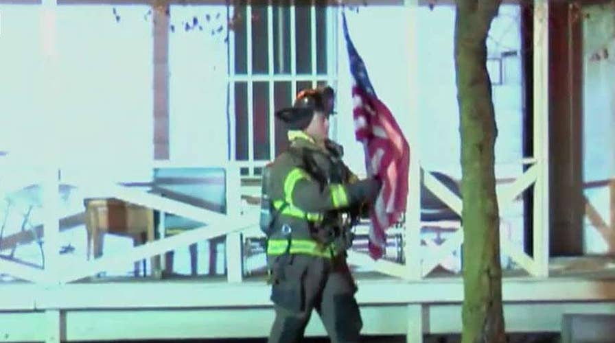 Firefighter, navy veteran saves home owner's American flag from burning Ohio home moments before the house collapses