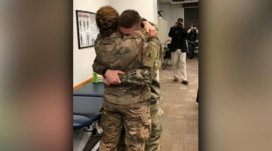 Army couple's surprise reunion caught on camera