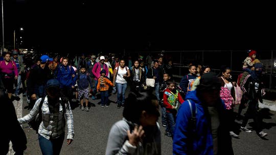 Honduran migrant caravan crosses into Mexico through open border checkpoint