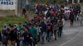 Migrant caravan from Honduras crosses into Mexico after gates were left open