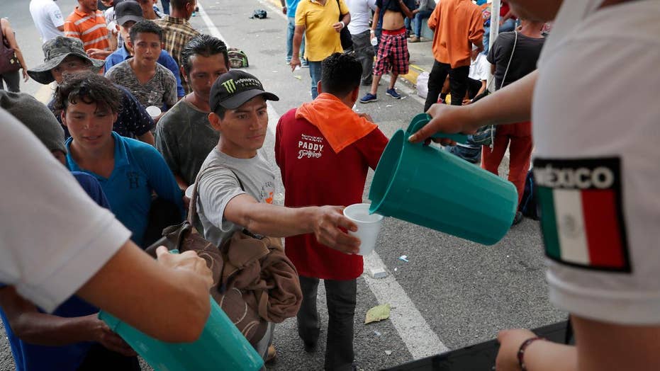 Thousands of caravan migrants request temporary asylum in Mexico; some try returning to US