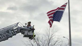 Flipped-over American flag set right after sharp-eyed Missouri cop, an Air Force vet, gets firefighters' help