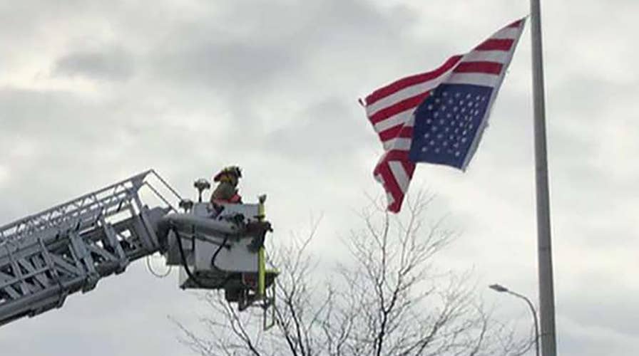 Missouri police officer enlists fire department to fix American flag hanging upside-down