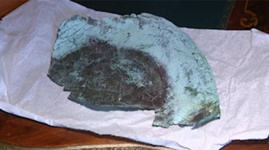 A mask fragment containing rare space metal washes ashore on a Florida beach