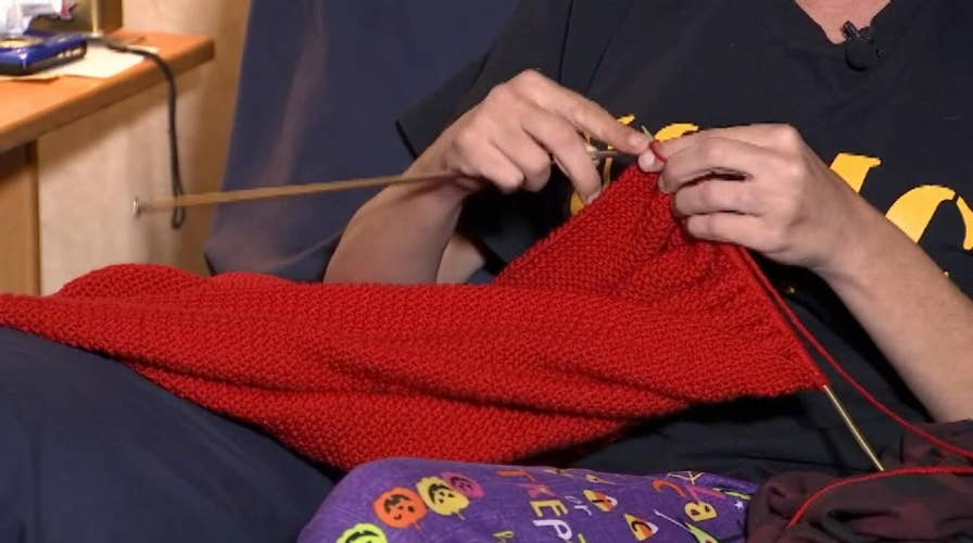 Florida woman knits huge flag to honor the service of military veterans.