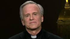 Notre Dame president defends covering Columbus murals