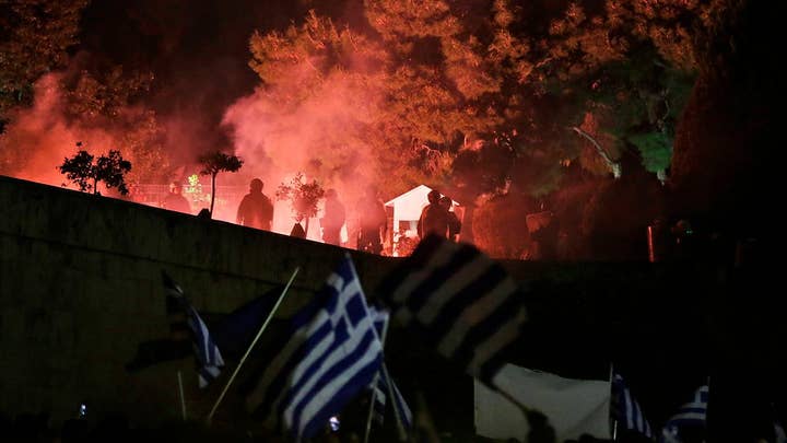 Protests turn violent outside Greek parliament as lawmakers were debating agreement to rename Macedonia