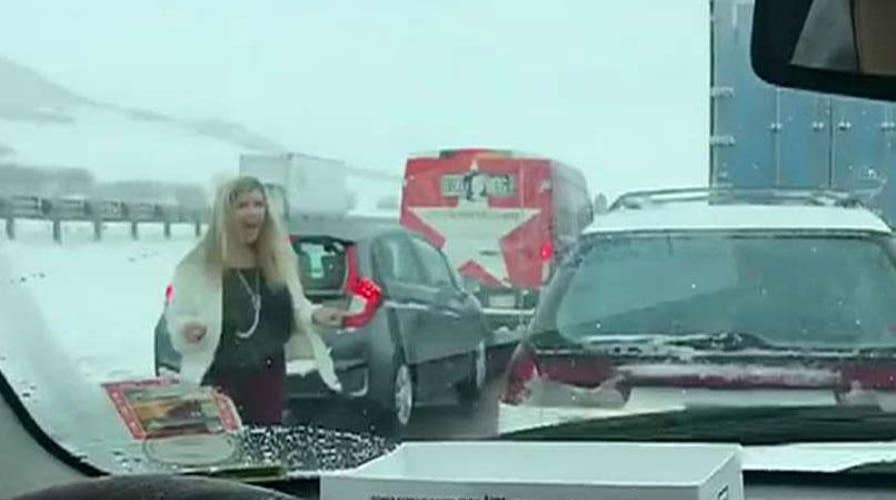 Mother seen dancing to Backstreet Boys during snowy, gridlocked traffic