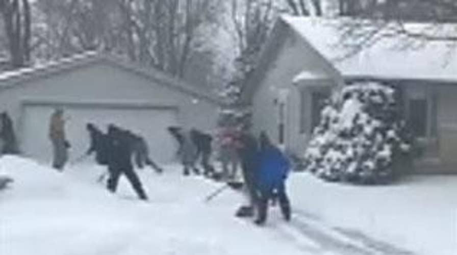 Wisconsin high school wrestling team spends snow day helping neighbors shovel snow
