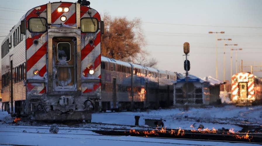 Polar vortex forces Chicago rail crews to use fire to keep trains moving