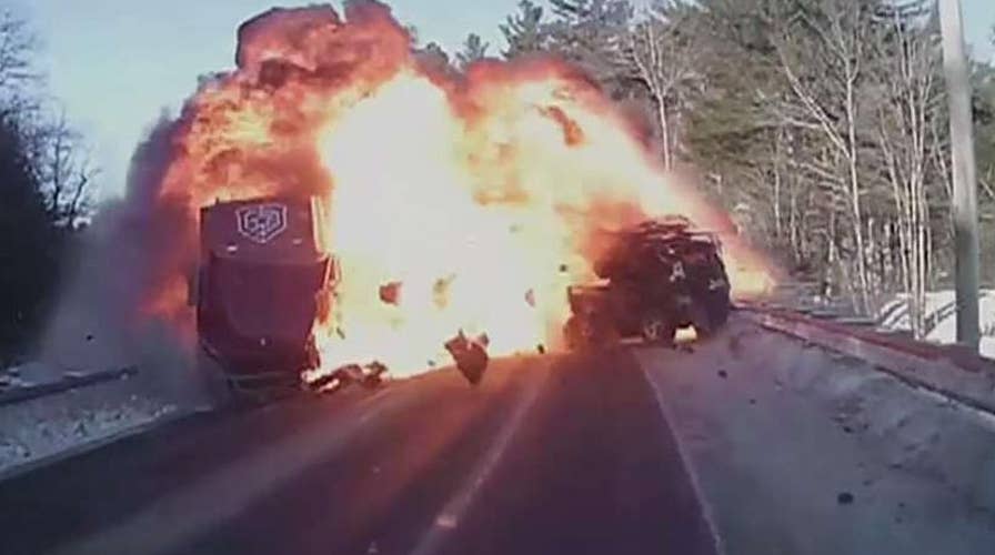 Father and son rescue driver from burning car following crash with a semi-truck