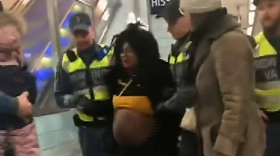 Raw video: Visibly pregnant woman physically removed from Stockholm metro