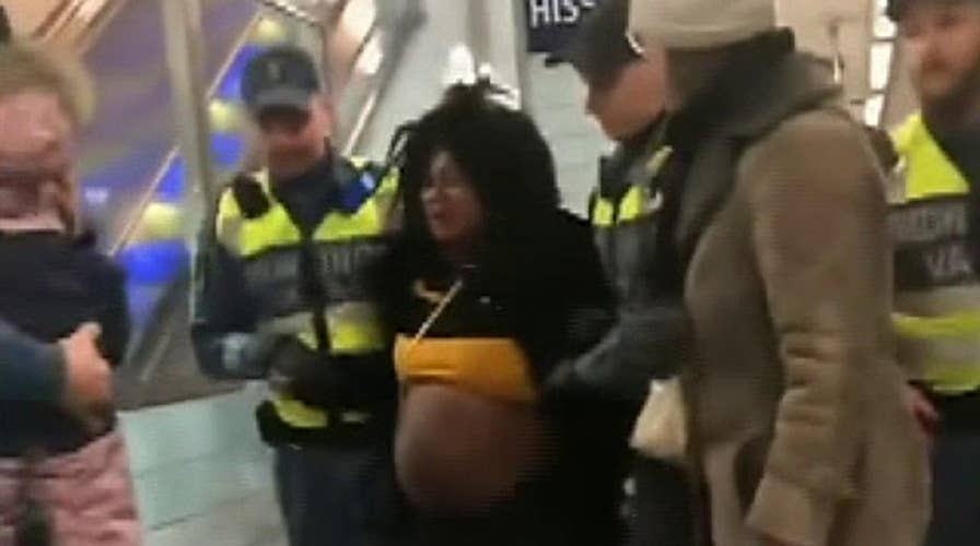 Raw video: Visibly pregnant woman physically removed from Stockholm metro