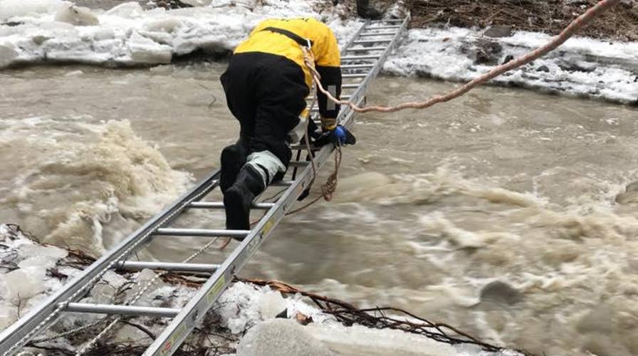 Fisherman stranded after falling through ice