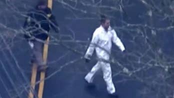 Town employee demoted for snapping, sharing photos of body found in suitcase: report