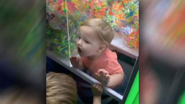 Raw video: Firefighters called to rescue kid trapped in claw machine