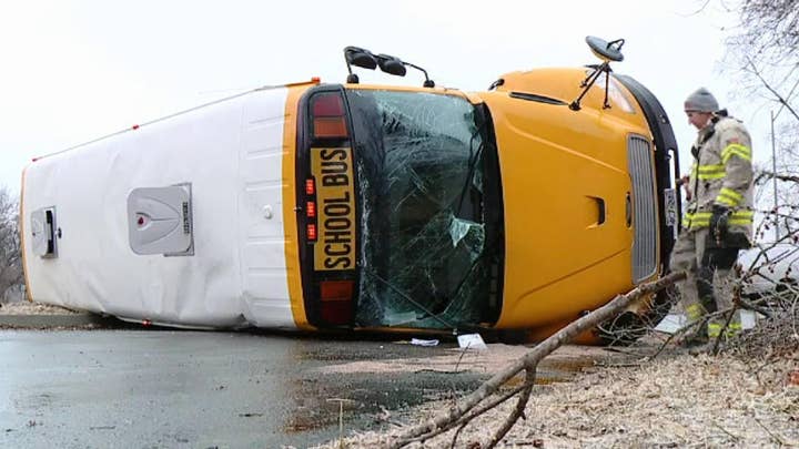 School bus flips while rounding a corner in a Missouri neighborhood
