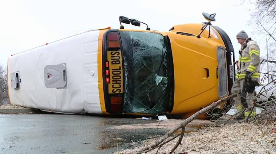 School bus flips while rounding a corner in a Missouri neighborhood