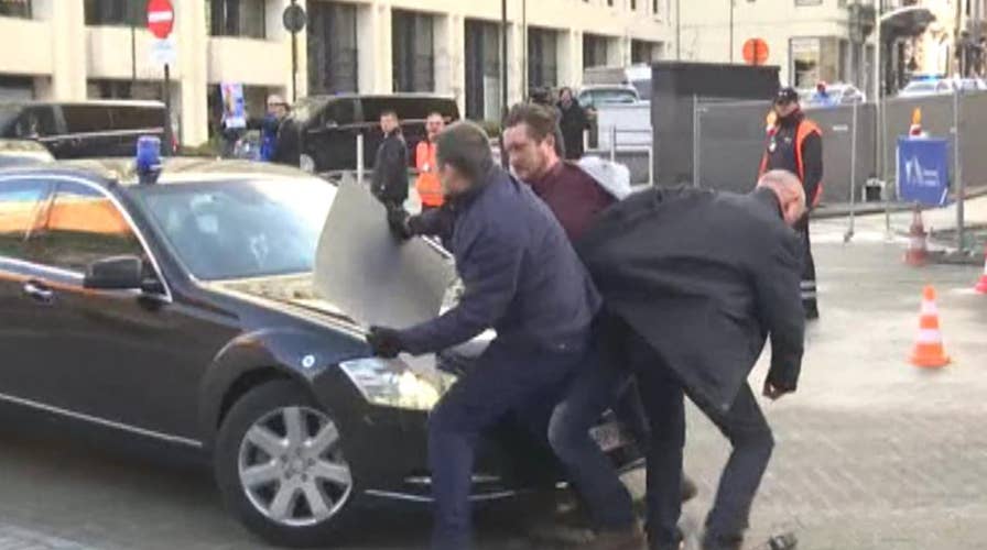 Brexit protester jumps in front of UK Prime Minister’s convoy