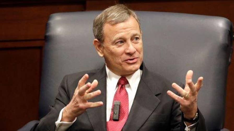 Chief Justice John Roberts joined the Supreme Court's liberal wing in temporarily blocking a Louisiana abortion law
