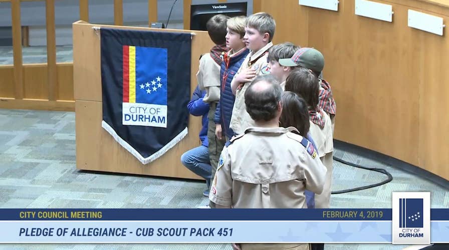 10-year-old Cub Scout takes a knee during Pledge of Allegiance at city council meeting in North Carolina