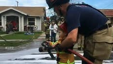 California boy, 2, helps firefighter responding to call, video shows