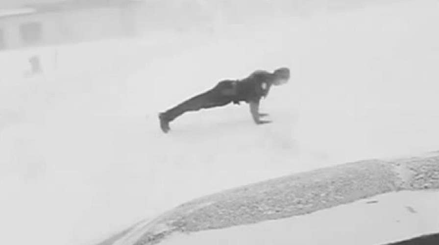 Fargo police officer does push-ups in the snow to honor fallen comrades