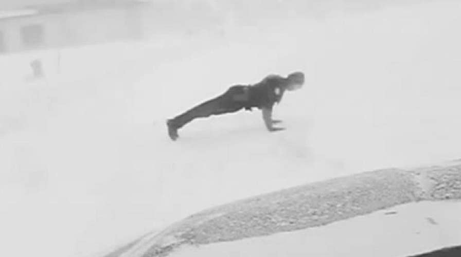 Fargo police officer does push-ups in the snow to honor fallen comrades