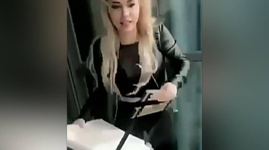 Woman throws chair from high rise building into rush hour traffic