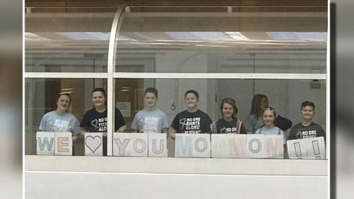 Grandmother battling brain cancer sees support from hospital room window