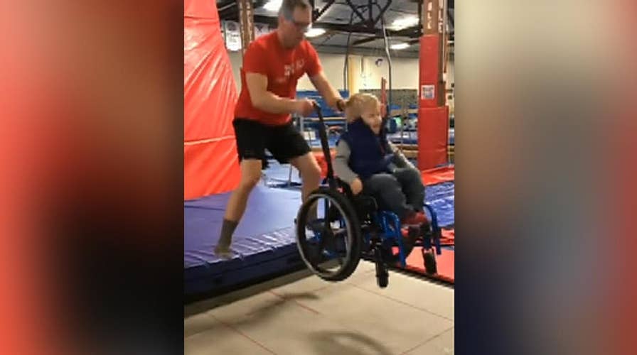 Video of boy in wheelchair taking his turn on a trampoline goes viral