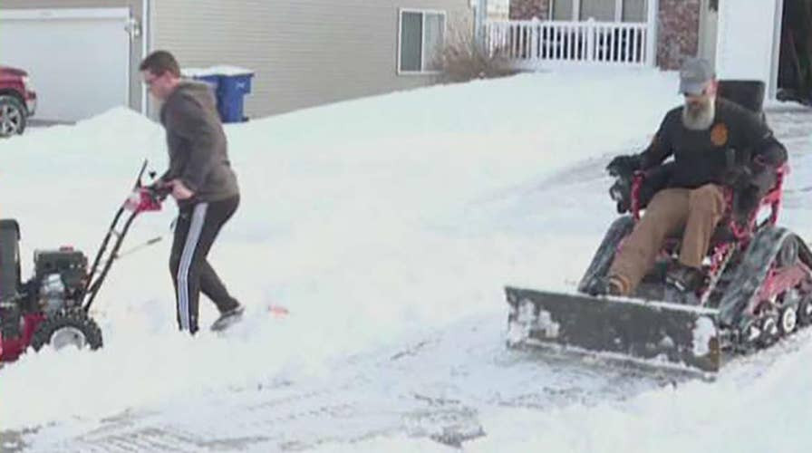 Wounded veteran teams up with teen neighbor to shovel snow in the community